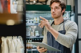 person looking at inventory and tracking on tablet